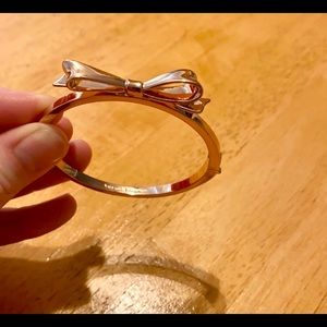 Kate Spade rose gold colored bow bracelet